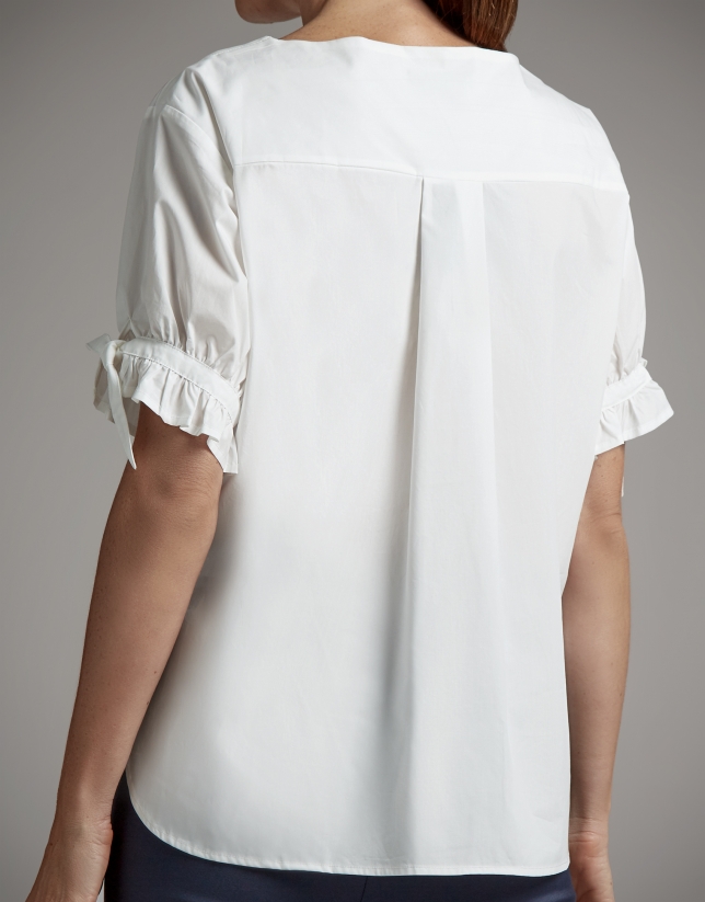 White asymmetric blouse with puffed sleeves