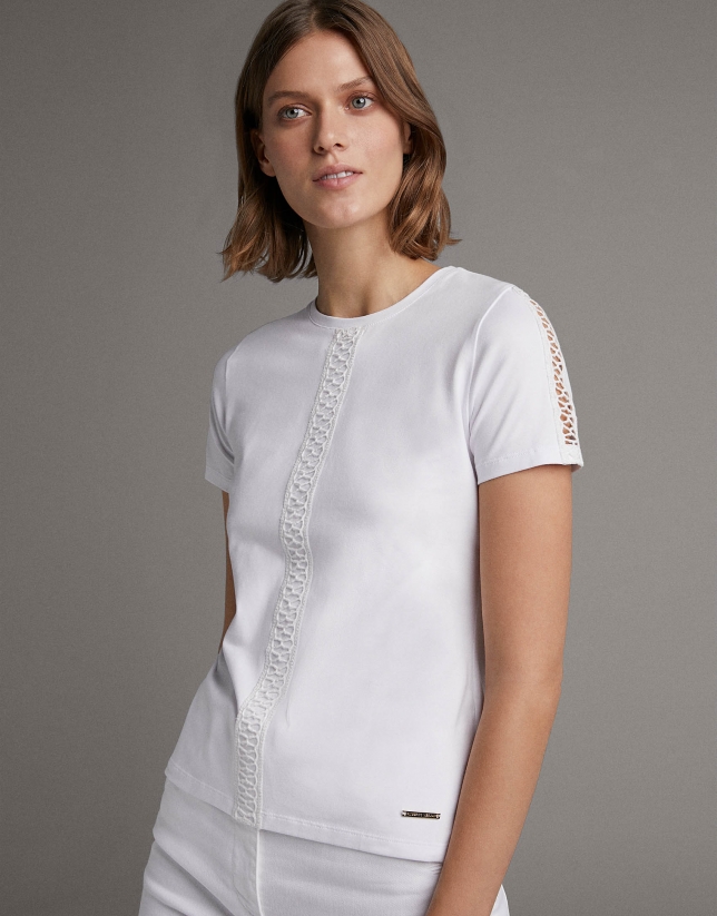 White top with lace on the front and sleeves