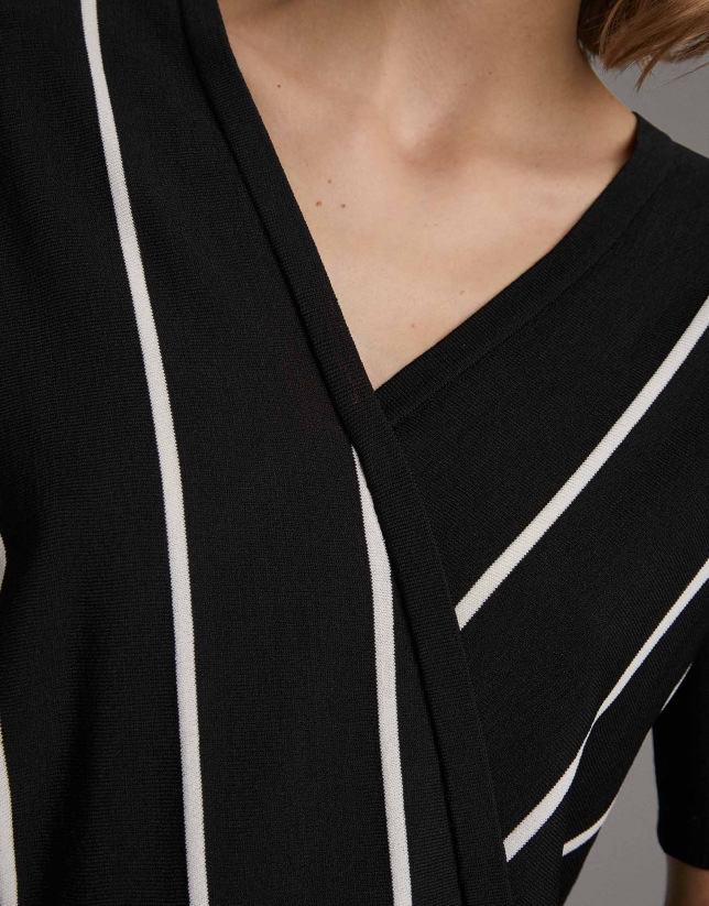 White and black striped sweater and crossover neckline
