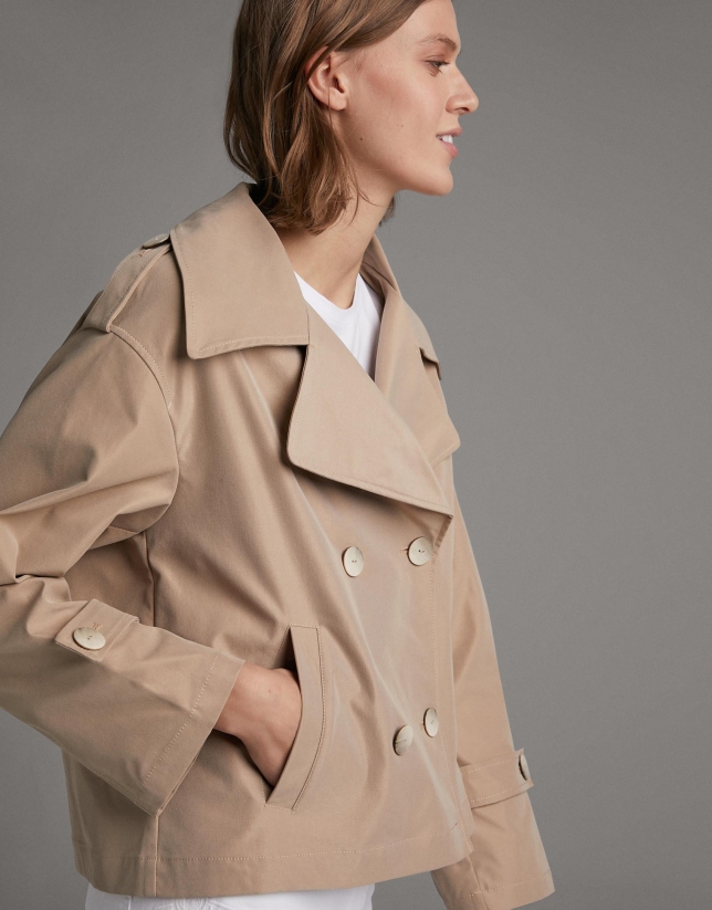 Short beige parka with double row of buttons