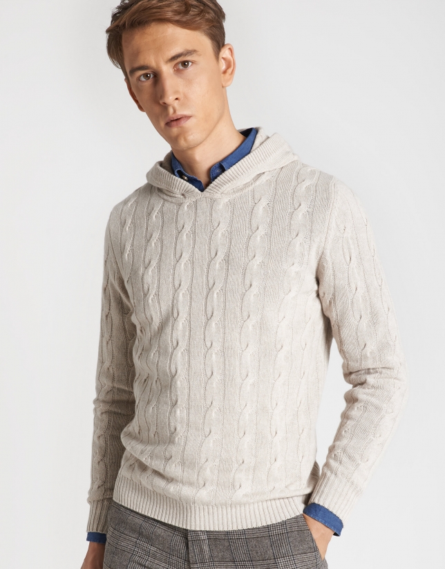 Beige sweater with cable stitching and hood