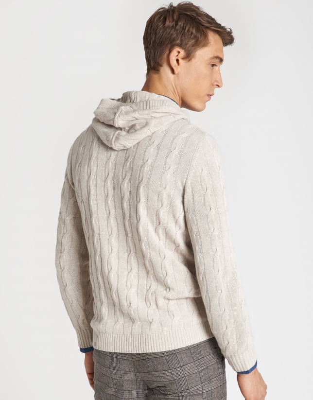 Beige sweater with cable stitching and hood