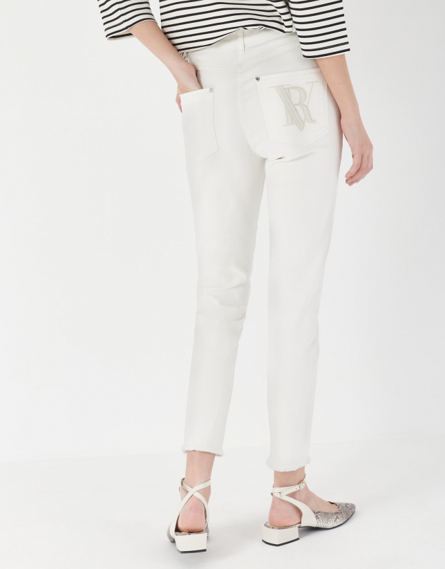 White pants with frayed bottom