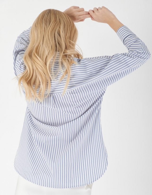 Blue and white striped loose blouse with long sleeves