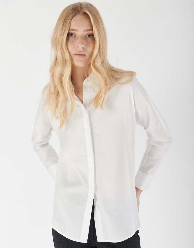 White loose blouse with long sleeves