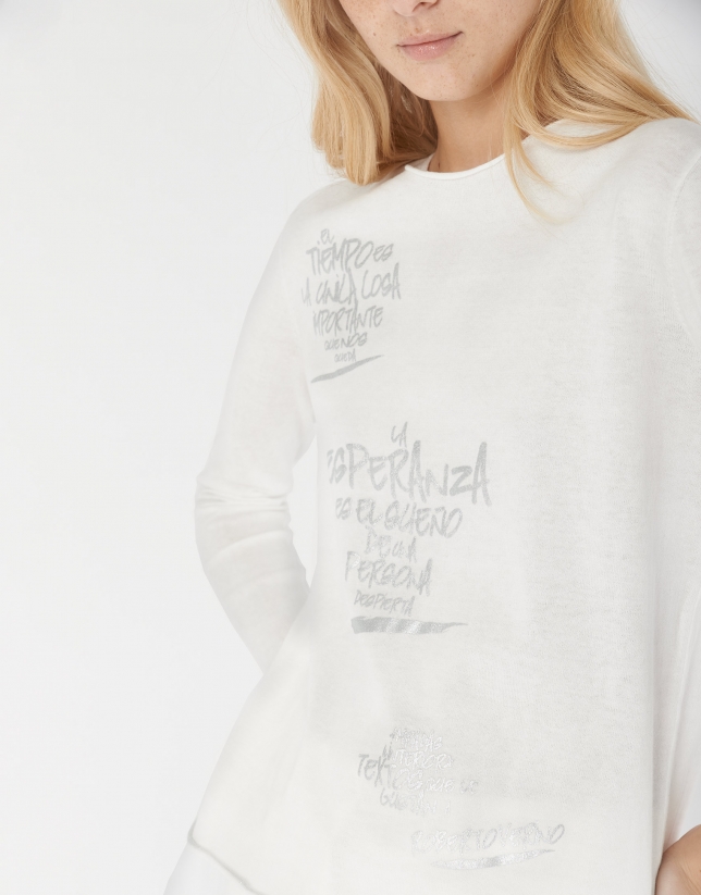 White top with long sleeves and decorative phrasing