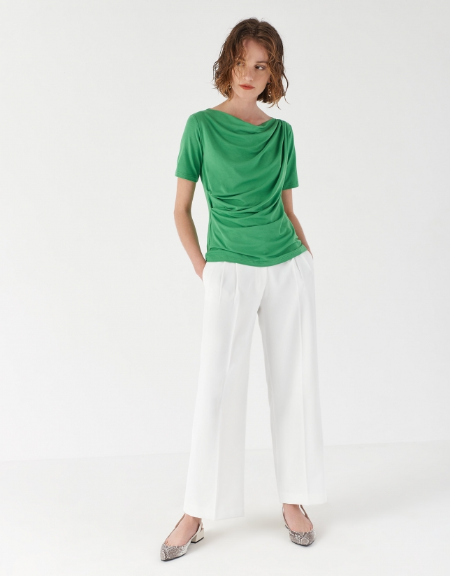 Green top with draping at waist