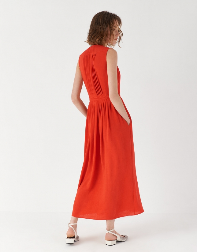 Red sleeveless dress with gathered V-neck