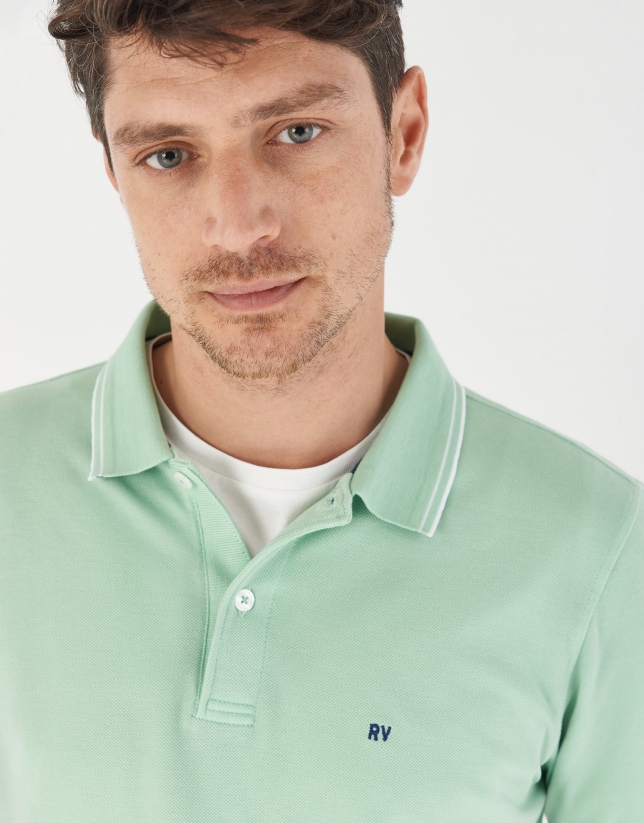 Green pique cotton polo shirt with white outlines
