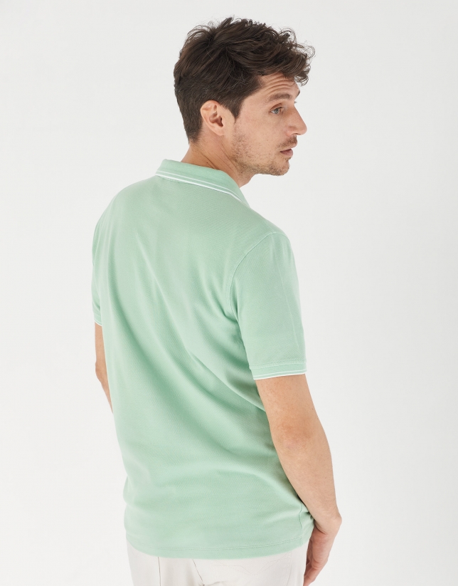 Green pique cotton polo shirt with white outlines