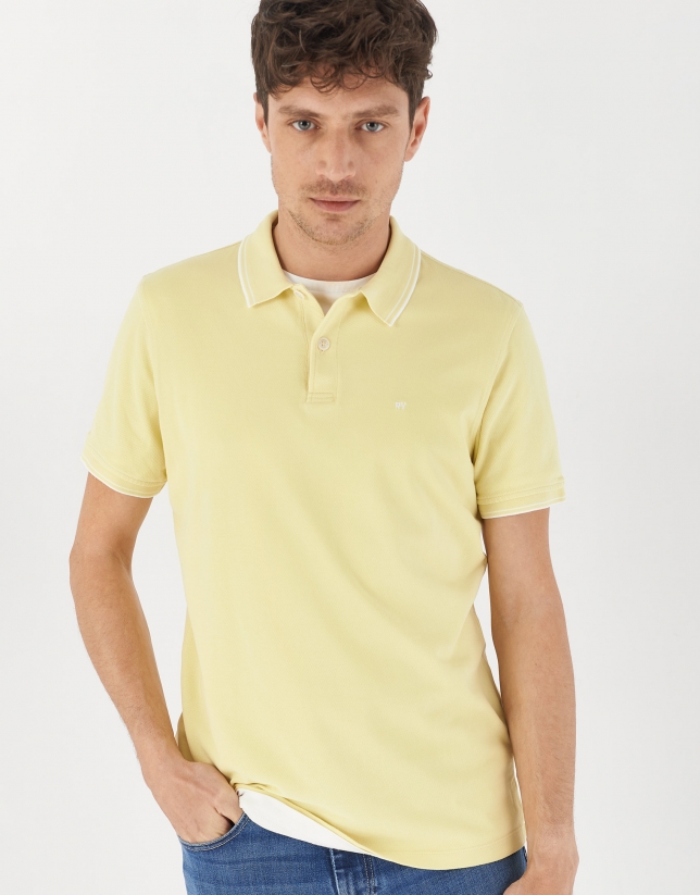 Yellow pique cotton polo shirt with white outlines