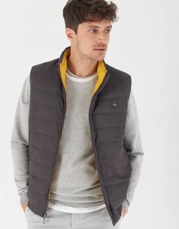 Gray and yellow brown reversible vest with down quilting 