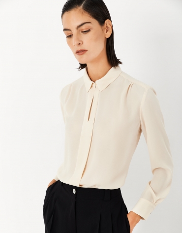 Beige shirt with central pleat