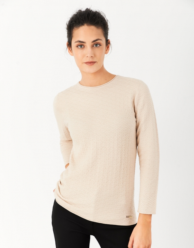 Beige textured knit top with long sleeves