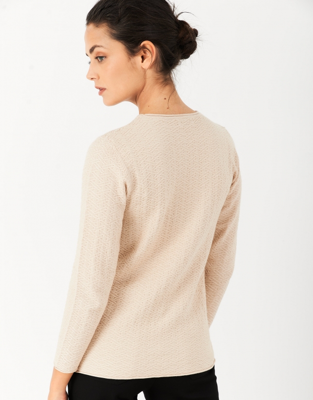 Beige textured knit top with long sleeves