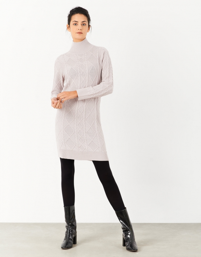 Elaborate pink knit dress with stovepipe collar