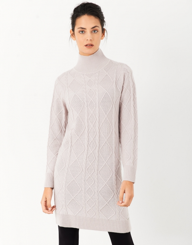 Elaborate pink knit dress with stovepipe collar