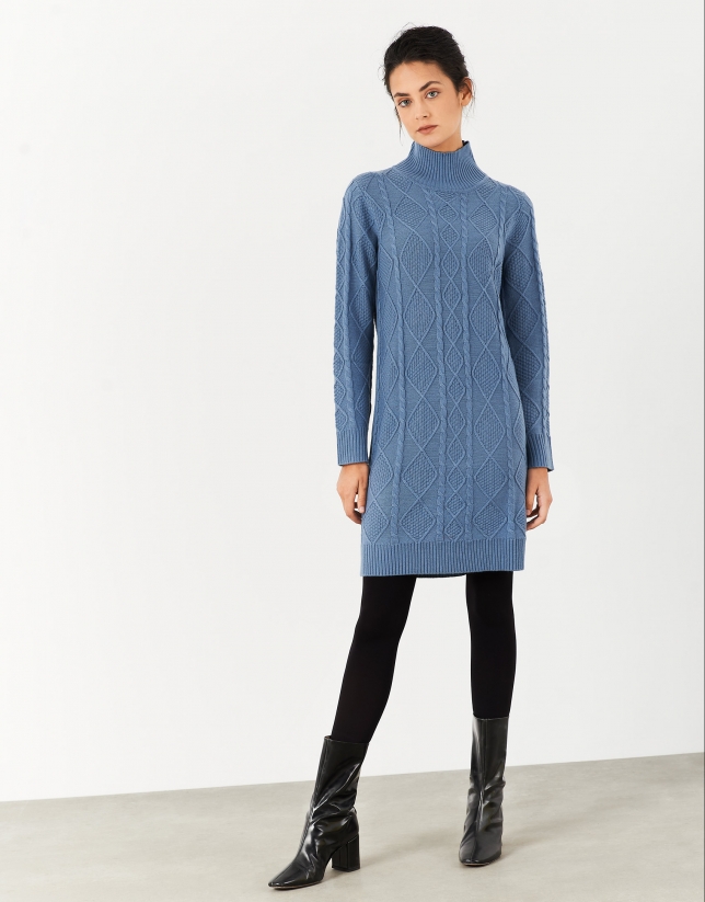 Elaborate blue knit dress with stovepipe collar