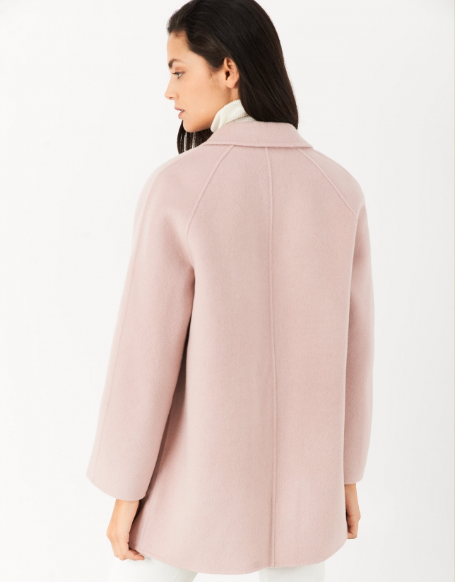 Short pink coat with double row of buttons