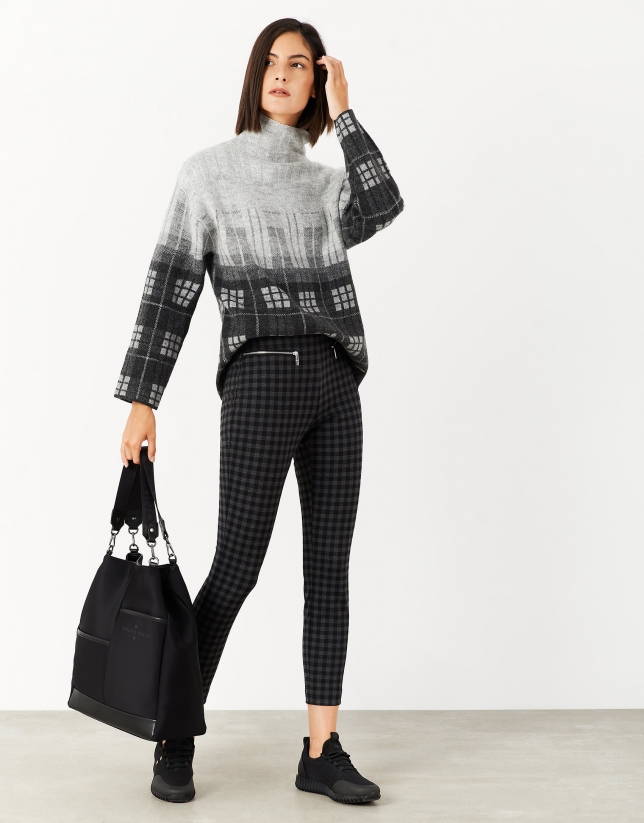 Gray and black checked knit sweater with high collar