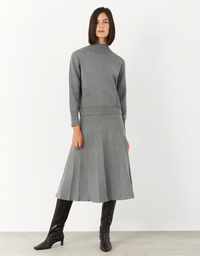 Gray sweater with raised collar and pockets