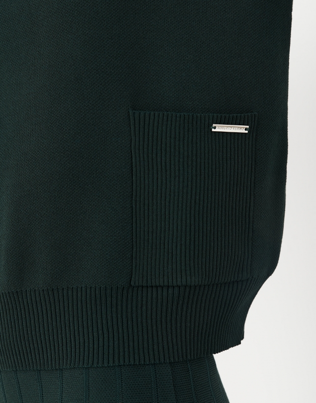 Green sweater with raised collar and pockets