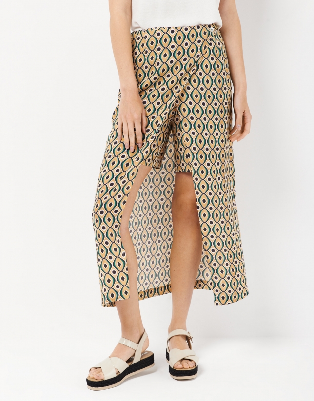 Midi flowing skirt over shorts, with a green print