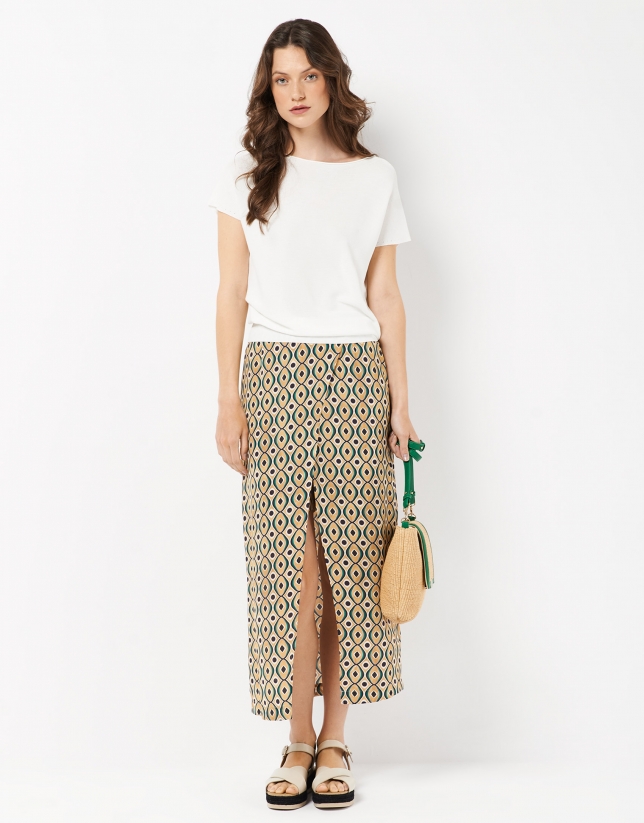 Midi flowing skirt over shorts, with a green print