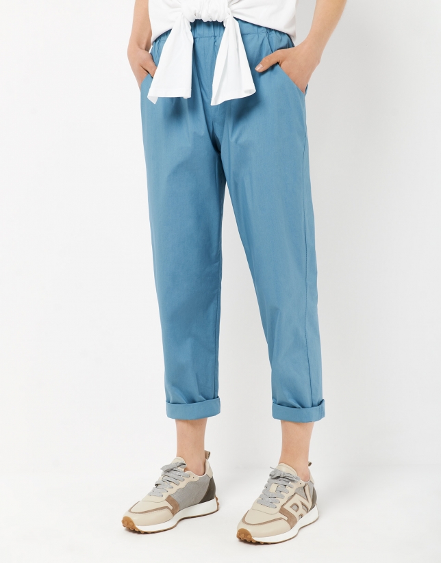 Blue trousers with gathered waist