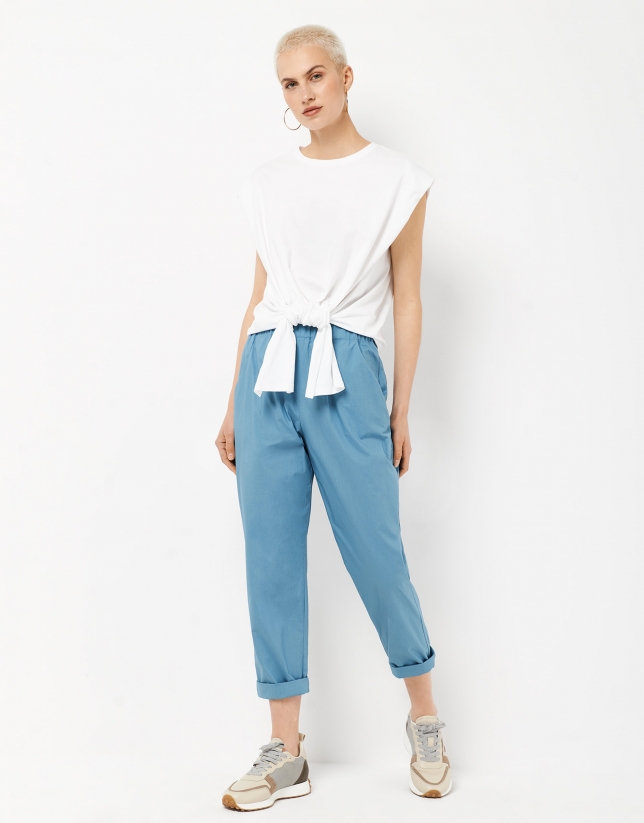 Blue trousers with gathered waist