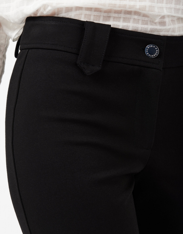 Black stovepipe pants with slits at hem