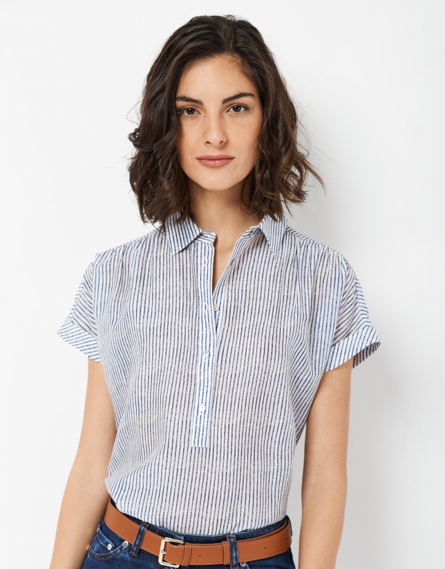 White sleeveless blouse with fine blue lines