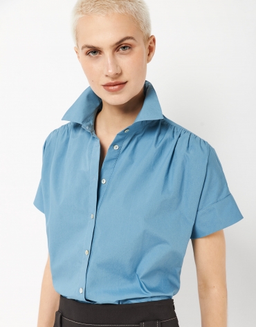 Blue blouse with puckered shoulders