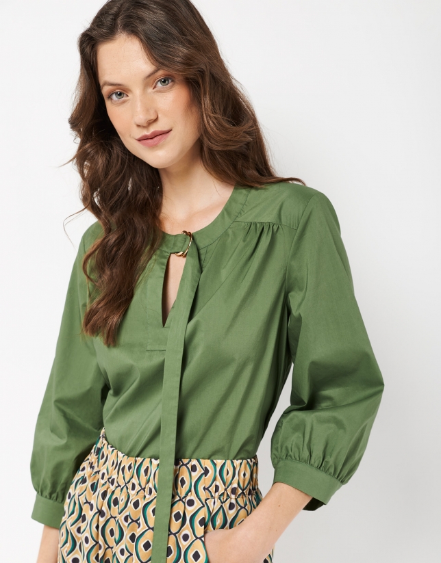 Green blouse with boat neck and bow
