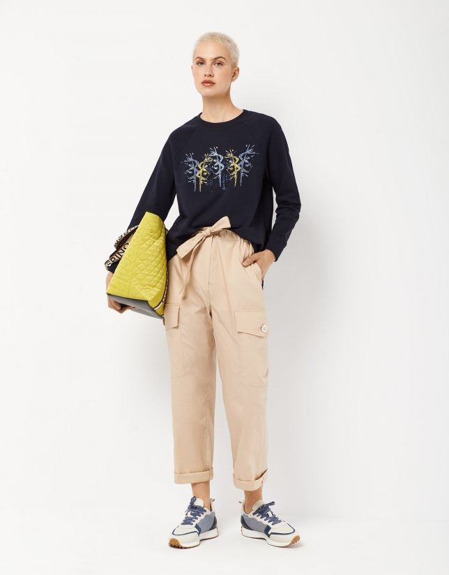 Navy blue sweatshirt with embroidered flower in the front