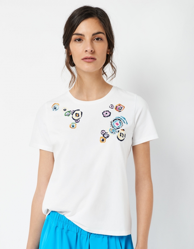 Top with embroidered circle design