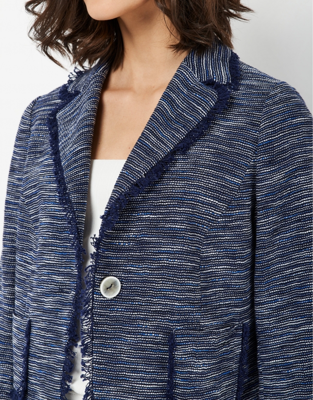 Short blue jacket with frayed edges