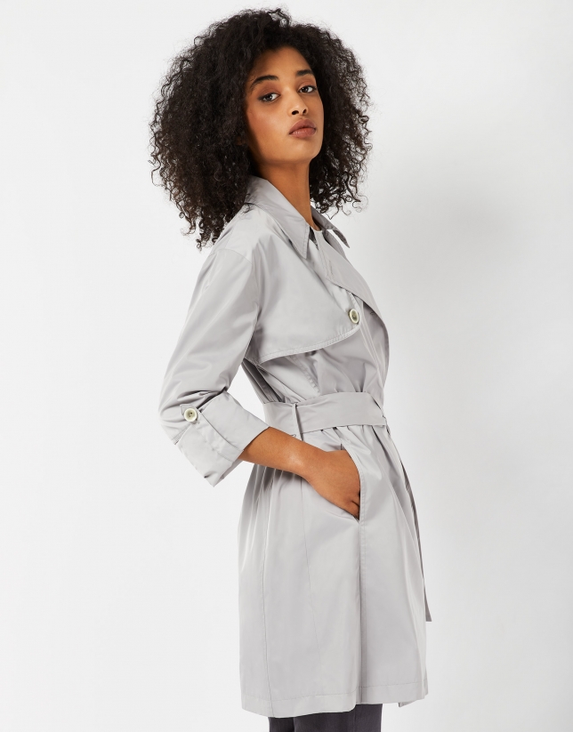 Light gray raincoat with double row of buttons