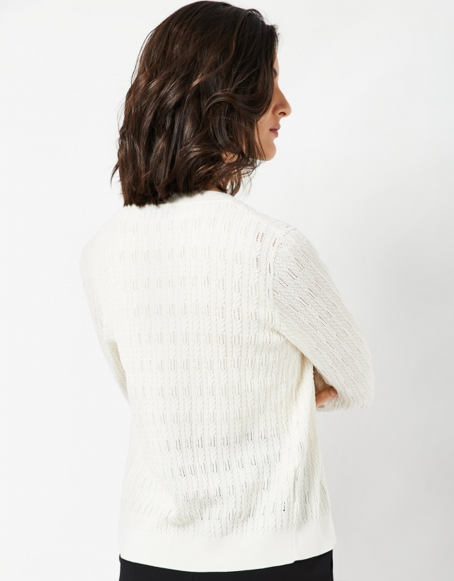 Beige knit cardigan with interlaced cable stitching