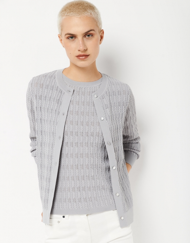 Gray knit cardigan with interlaced cable stitching