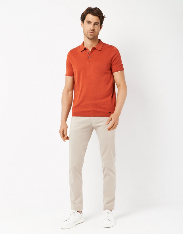 Orange knit polo shirt