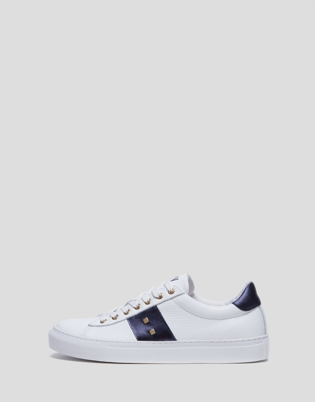 White and blue leather running shoes with studs