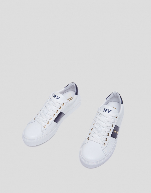 White and blue leather running shoes with studs