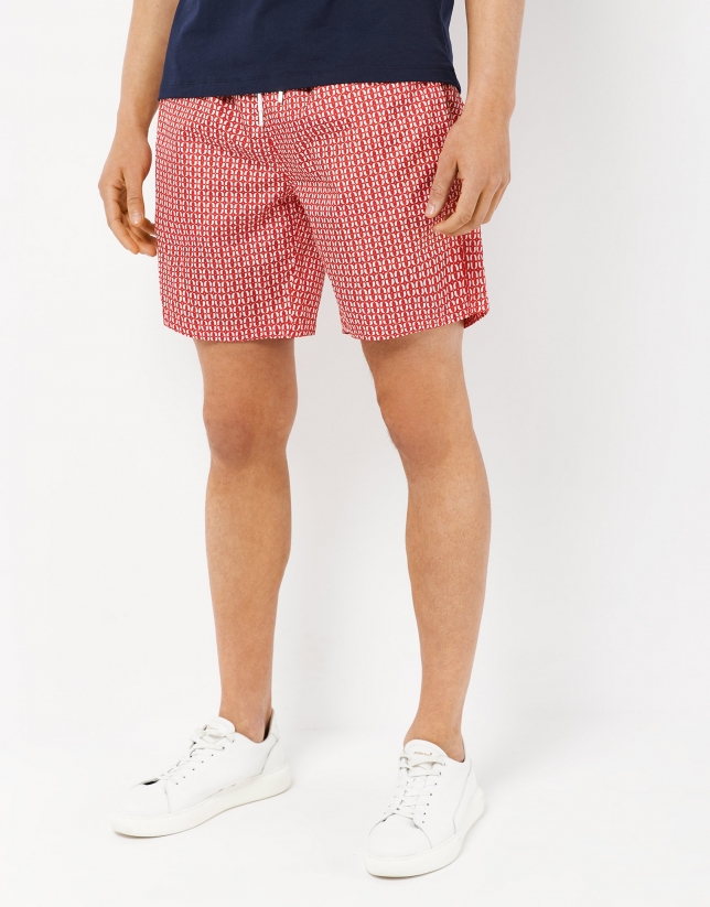 Red and white geometric swimming trunks