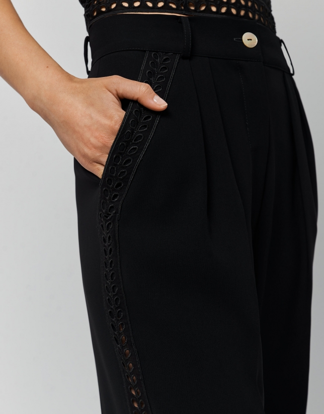Black crepe pants with side openwork ribbon 