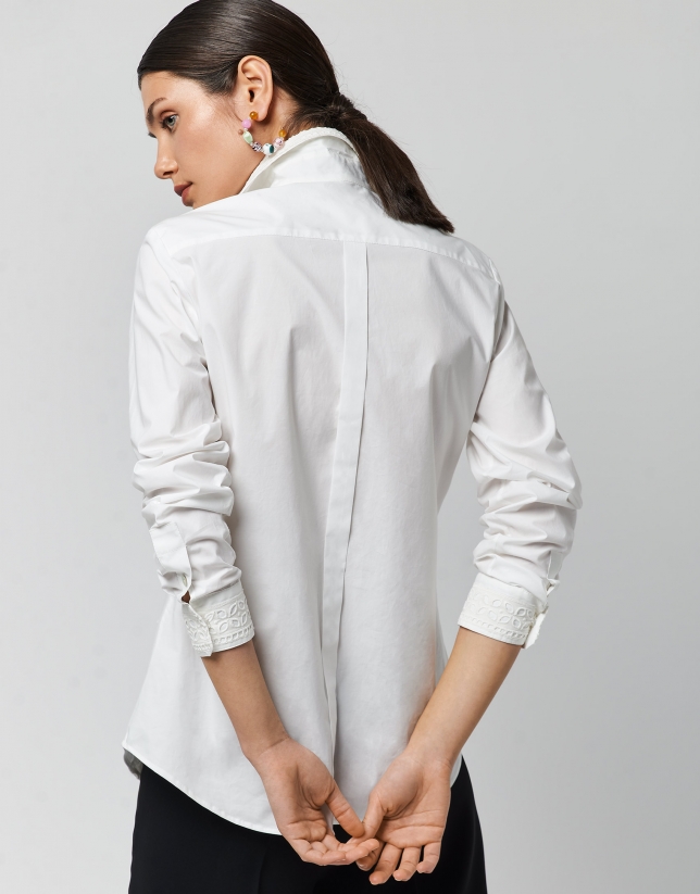 White cotton shirt with embroidered applique in the front