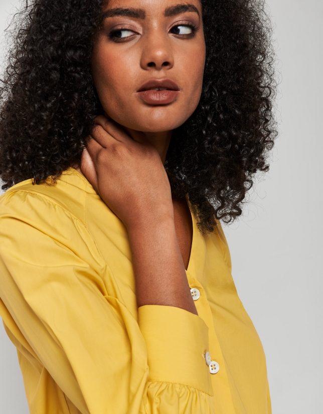 Yellow blouse with V-neck and bow