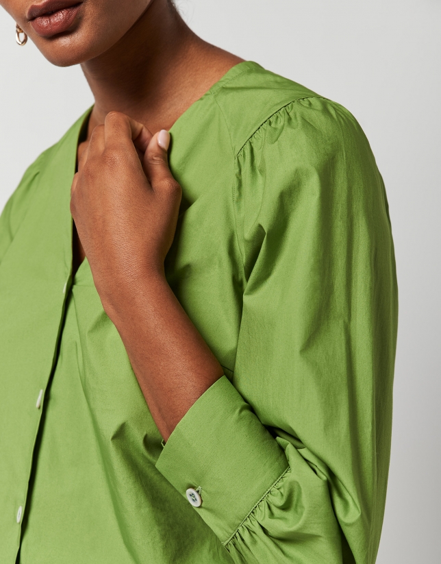 Green blouse with V-neck and bow