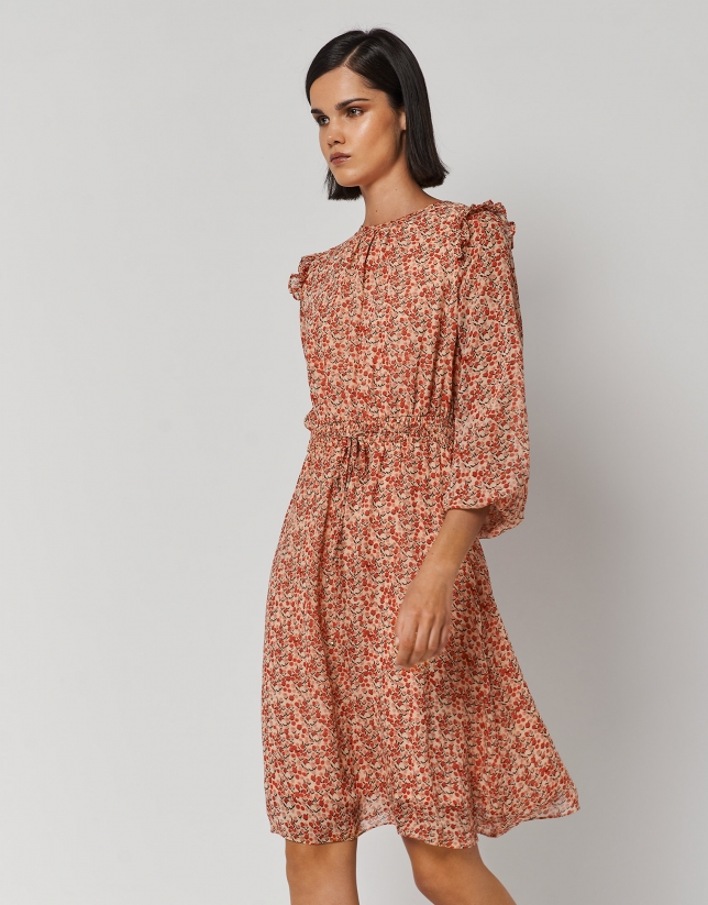Long-sleeved dress with ruffled shoulders and small orange flower print