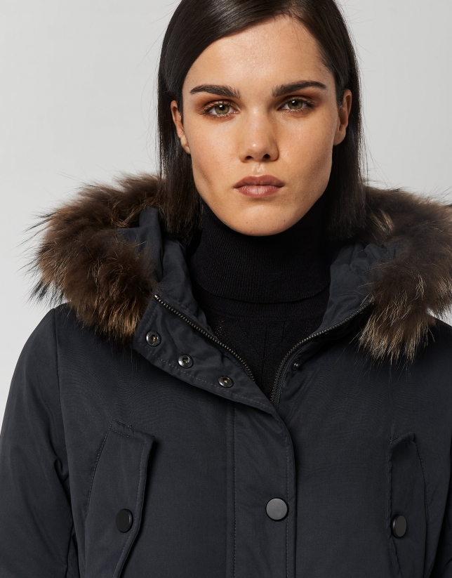 Navy blue quilted parka with fur trimmed hood